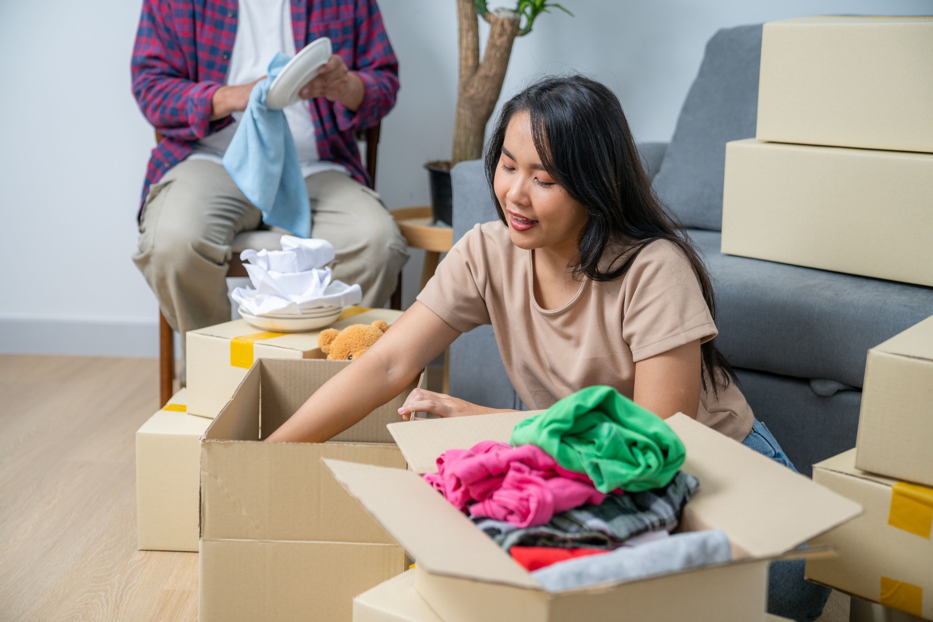 The couple is moving household items into their new home